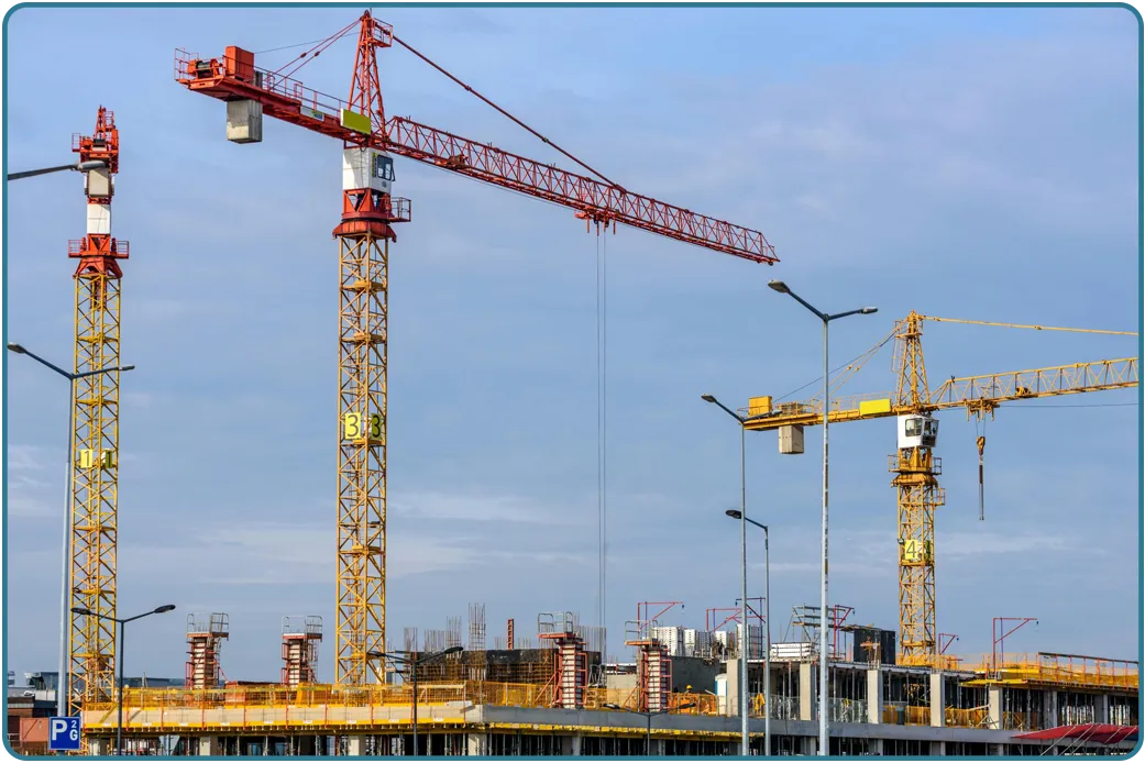 An active construction site with framing and equipment