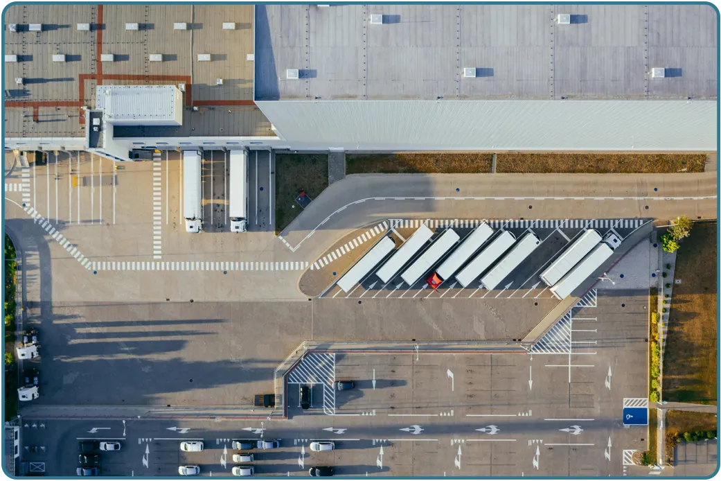 Rows of parked trucks and trailers in a logistics yard