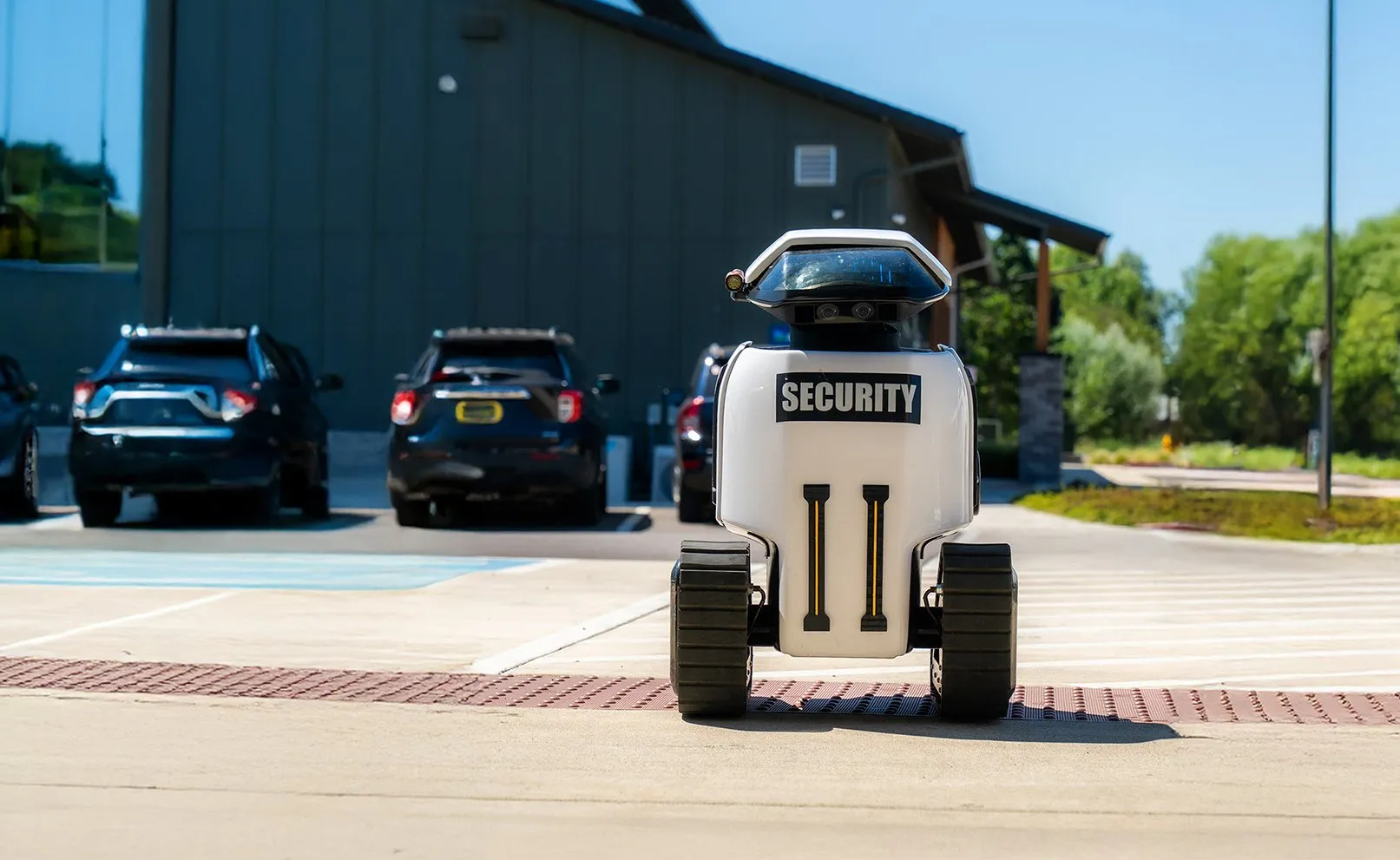 A Dax security robot on patrol in a parking lot
