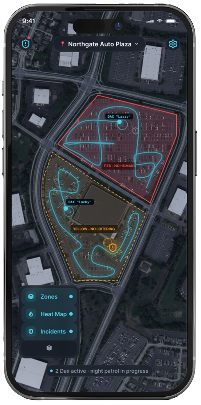 The Dax app's live fleet map: two robots' patrol paths over a site's zones